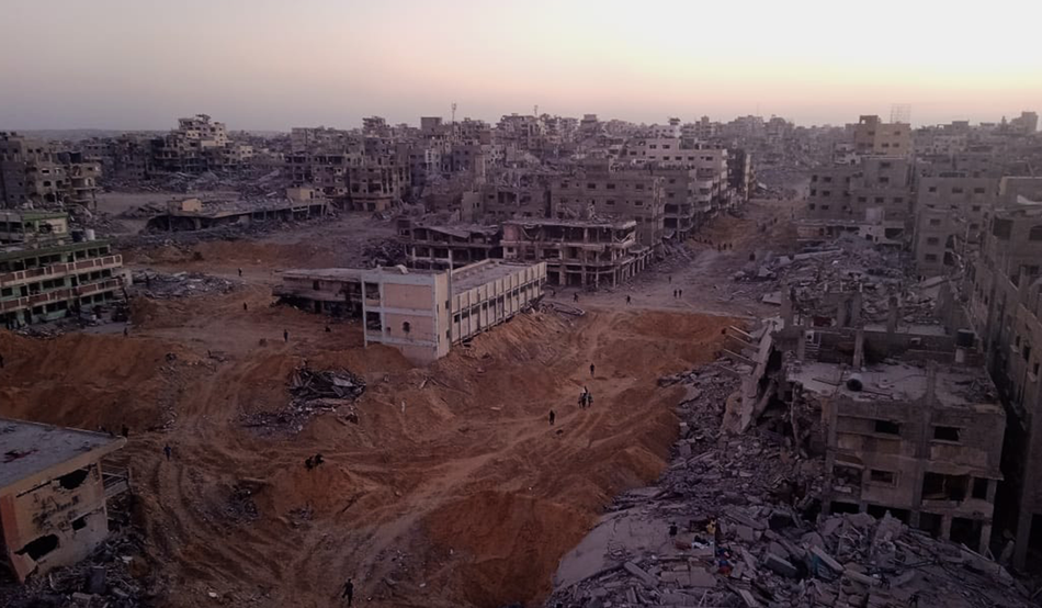 The damaged, former school in western Gaza (centre, white building) where Waheed al-Masri now lives. Image: Husam Maarouf