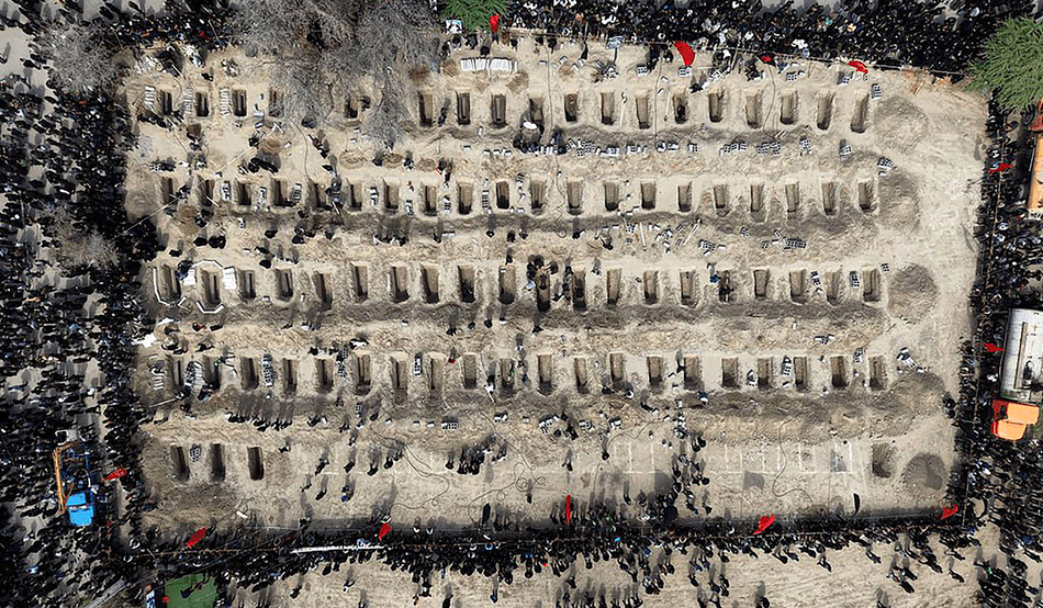 Mourners dig graves during the funeral of children killed in an airstrike on a primary school in Minab, Iran, 3rd 2026. Photo by UPI / Alamy Live News