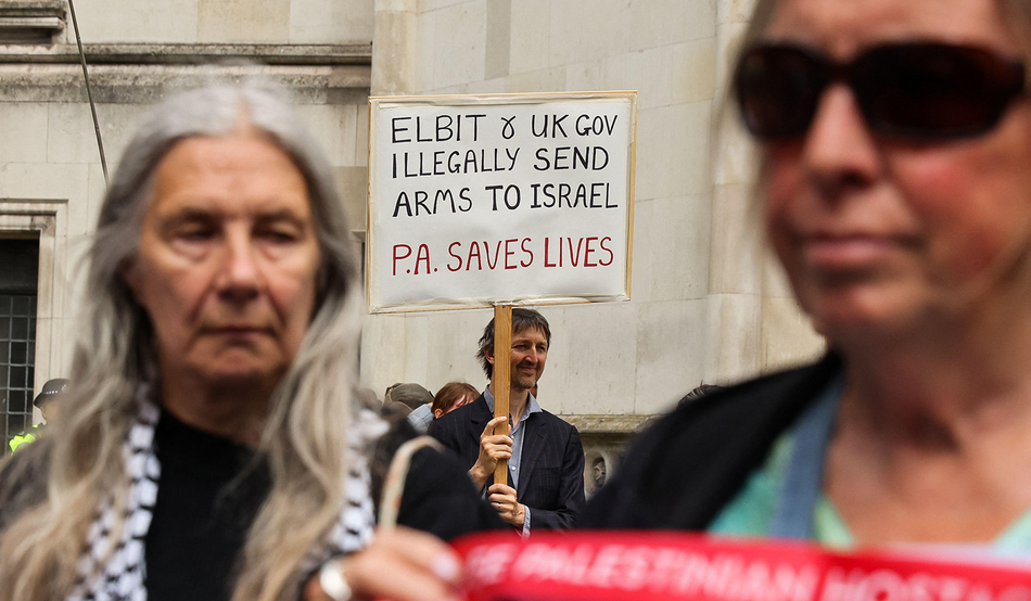 People outside the Royal Courts of Justice listen to the Court of Appeal's ruling in favour of the Palestine Action proscription, 15th June 2026. Credit: SOPA Images Limited/Alamy Live News