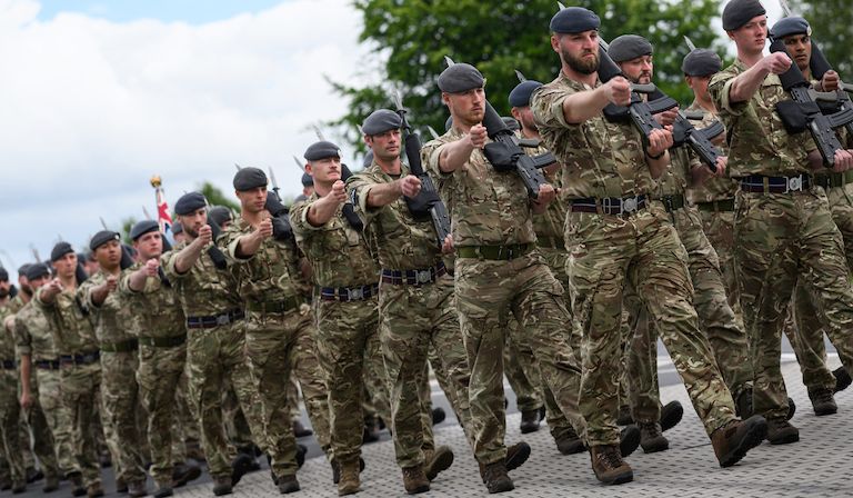 On the 80th anniversary of D-Day, British Royal Marines show off their marching skills. © LOIC VENANCE/AFP via Getty Images 