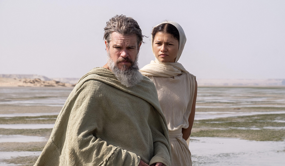 Zendaya, as Athena, accompanies Matt Damon’s Odysseus. Credit: Syncopy Production / Universal Pictures / Album / Alamy