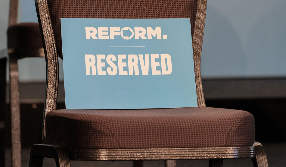 The seat for Andrea Jenkyns, the new Mayor of Lincolnshire, is marked with a card ahead of a Reform UK press conference in Whitehall last year. Image: Eleventh Hour Photography / Alamy
