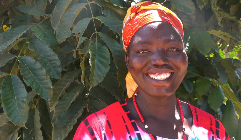Through her dairy co-operative, Juliet Aduto teaches pastoralists to care for their animals, and churns fresh milk into yogurt. She hopes building sustainable livelihoods will help combat the challenges posed by climate change. (Sophie Neiman)