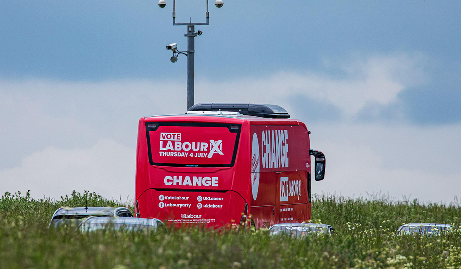 Labour's big red battle bus driving through Wiltshire ahead of the July election last year. Image: John Rose Photography / Alamy
