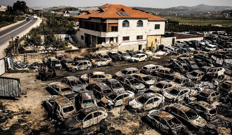 Shock waves: burnt-out cars in Huwara in the West Bank, in the aftermath of  a brutal raid by armed settlers this February © ZUMA Press Inc / Alamy Stock Photo