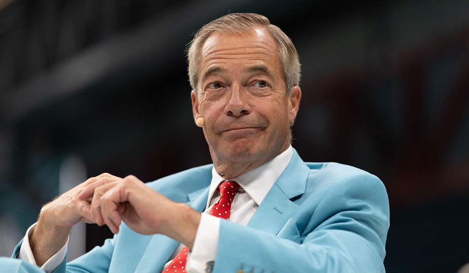 Nigel Farage speaks at the Reform UK conference this year. Image: Sipa US / Alamy