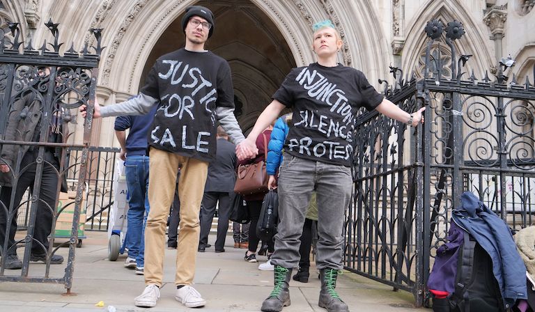 A close bond: friends Callum Goode and Tez Burns outside the Royal Courts of Justice. Photo: © Jamie Lowe