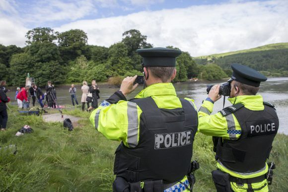 PSNI Officers film and photograp pro-choice activists as they wait for a delivery abortion pills for women in Northern Ireland from the Irish Republic using a radio controlled speedboat. Photo: PA