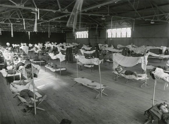 Mandatory Credit: Photo by Everett/Shutterstock (10112180a) Spanish Flu Epidemic 1918-1919 in America, Nov. 7, 1918. Young soldiers, convalescing from influenza patients are isolated in a large room at Eberts Field, Lonoke, Arkansas. This infirmary was se