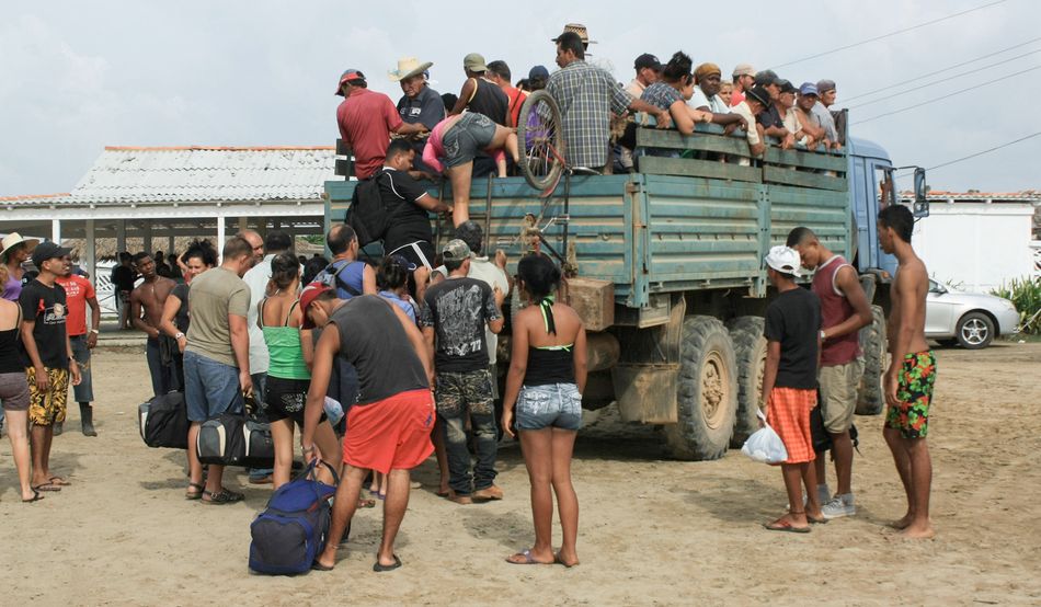 Migrants in Tapachula board a truck destined for the US. Image: Alamy.
