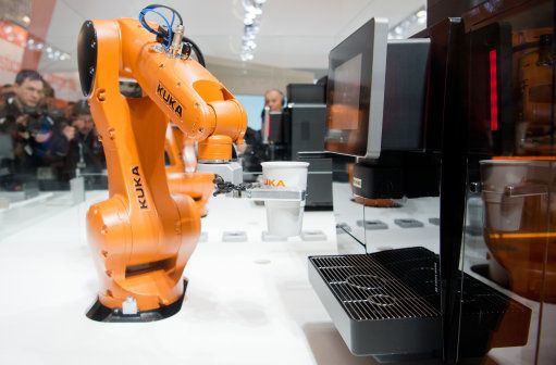 The Cooffe 4.0 system, consisting of an app and a robot, makes coffe at the exhibition booth of Kuka at Hanover fair in Hanover, Germany, 23 April 2016. The world's biggest industry fair Hanover Messe is being opened by US-President Obama on 24 April. The