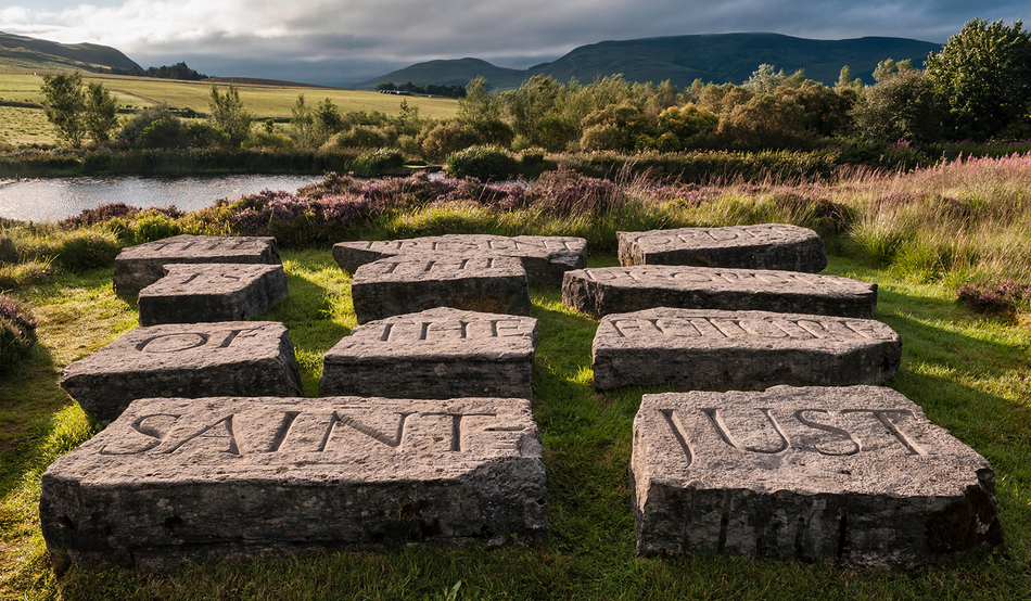 “The Present Order is the Disorder of the Future”: one of Finlay’s monumental stone sculptures in Little Sparta. Image: gardenpics / Alamy