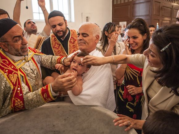 Everyday memories: a baptism in Syria © MARIO DONADONI, VIA WIKIMEDIA COMMONS