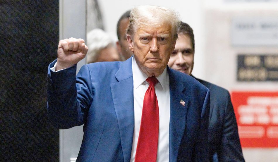 Returning from lunch during his criminal trial at New York State Supreme Court in April,  former president Trump appeared defiant. Image: Associated Press / Alamy Stock Photo