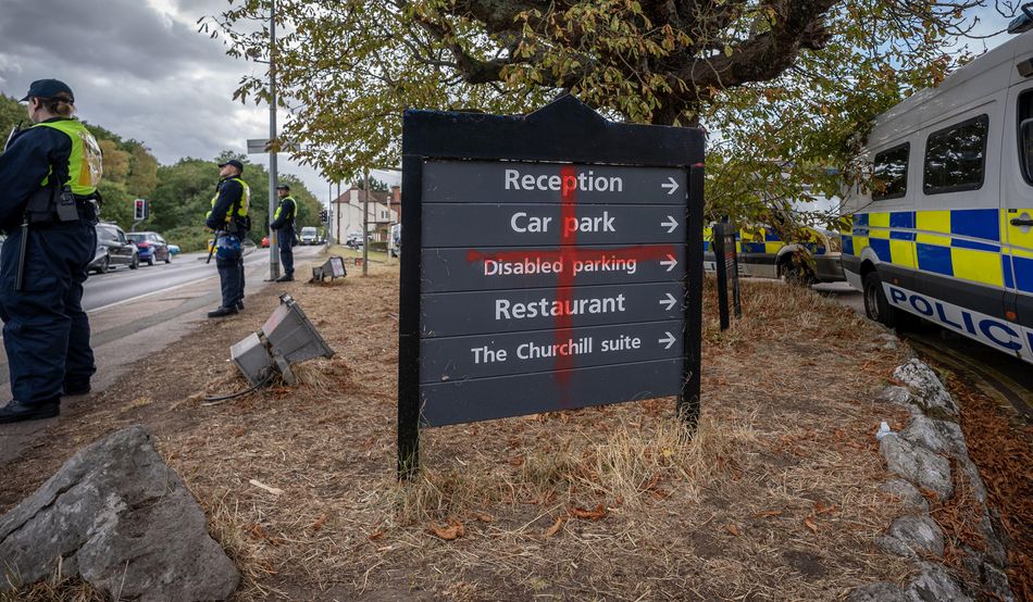 A St George's cross sprayed on signage at the Bell Hotel, Epping. Image by Alamy / Guy Corbishley