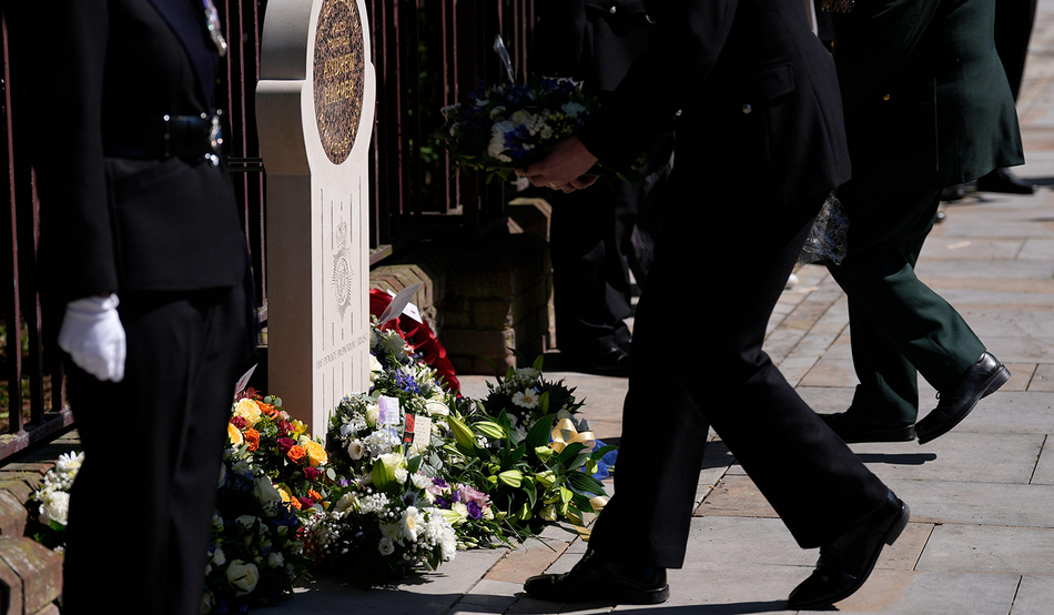 Wreaths are laid at the unveiling of a memorial stone in Reading dedicated to Police Constable Andrew Harper, 23rd April 2026. Photo by Alamy / PA Images