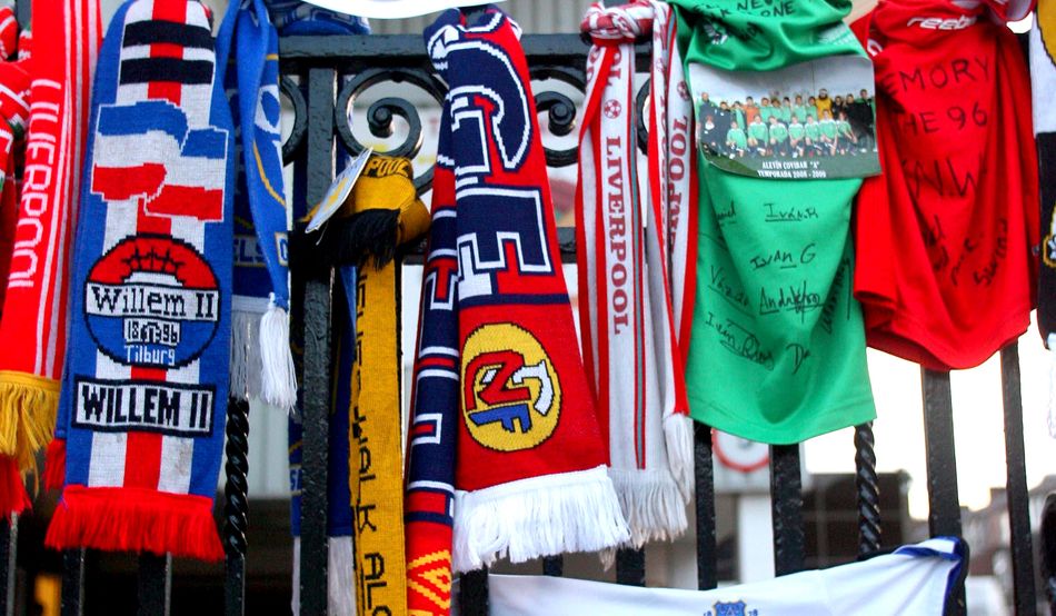 Football scarves tied to the Shankly Gates at Anfield before the 20th anniversary of the Hillsborough disaster. Photo by Alamy
