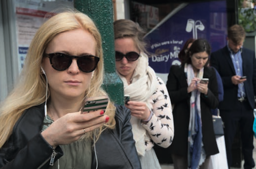 Eyes down, hands up: our addiction to smartphones and social media makes us increasingly valuable to the likes of Google and Facebook. © SAM MELLISH / IN PICTURES VIA GETTY IMAGES