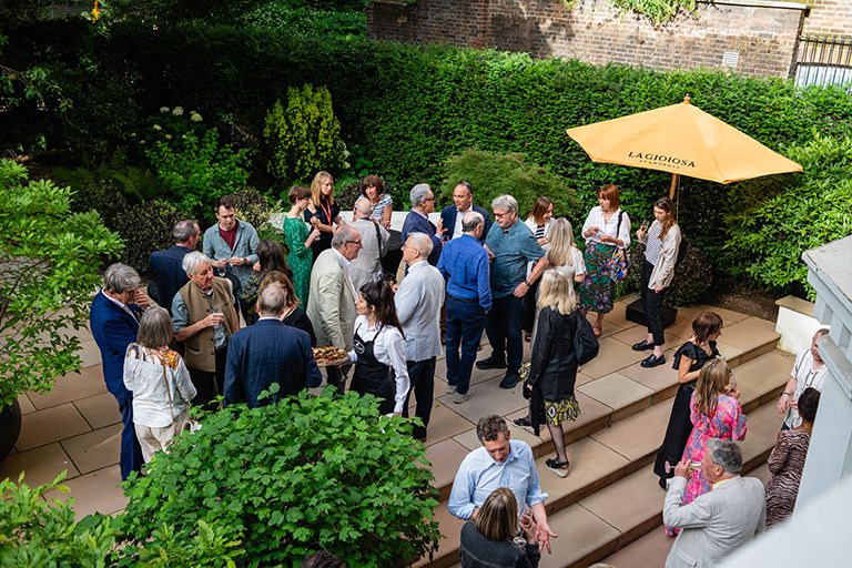 Guests enjoying the party in the garden of Prospect’s offices