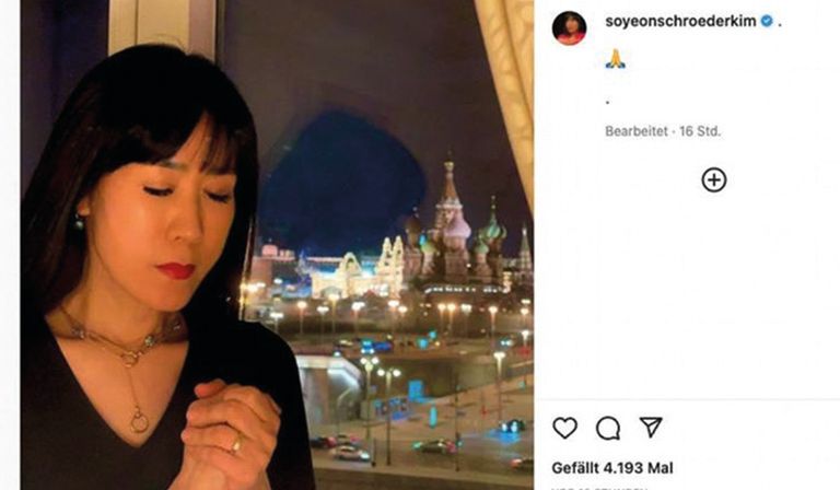 Empty gestures: Schröder’s wife, Soyeon Schröder-Kim, praying for peace on a trip 
to Moscow in March 2022 via Twitter