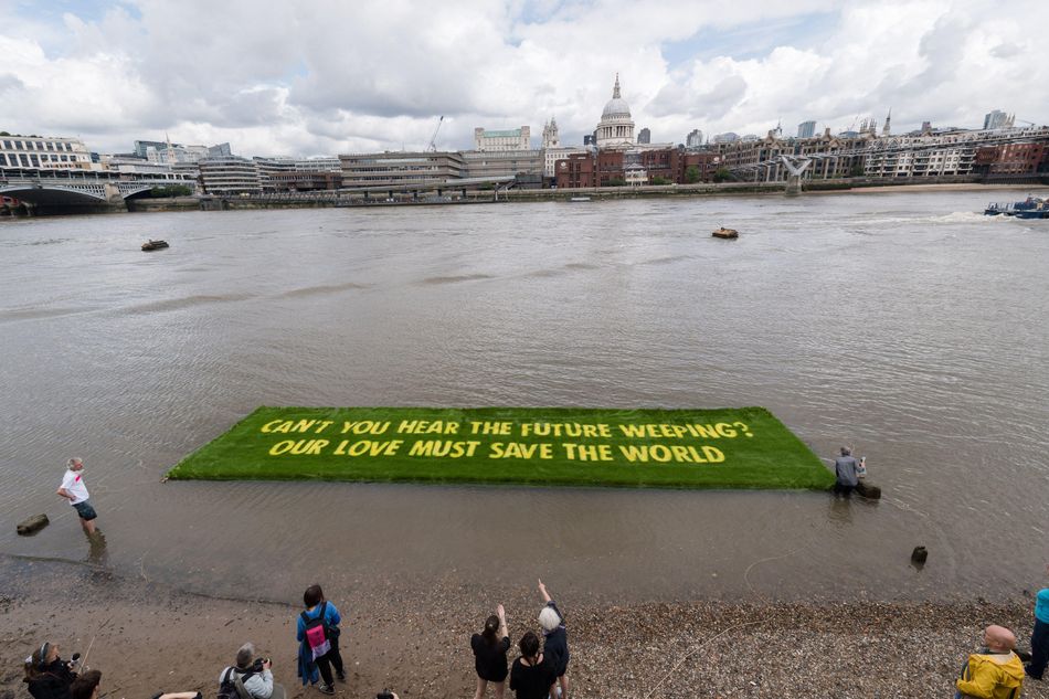 Words by Okri adorn an installation calling for stronger action on climate change. Image: Wiktor Szymanowicz / NurPhoto SRL