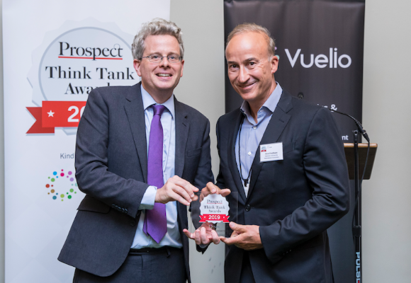 Prospect editor Tom Clark presents an Economics and Finance Award to Steve Freidheim of the Peterson Institute