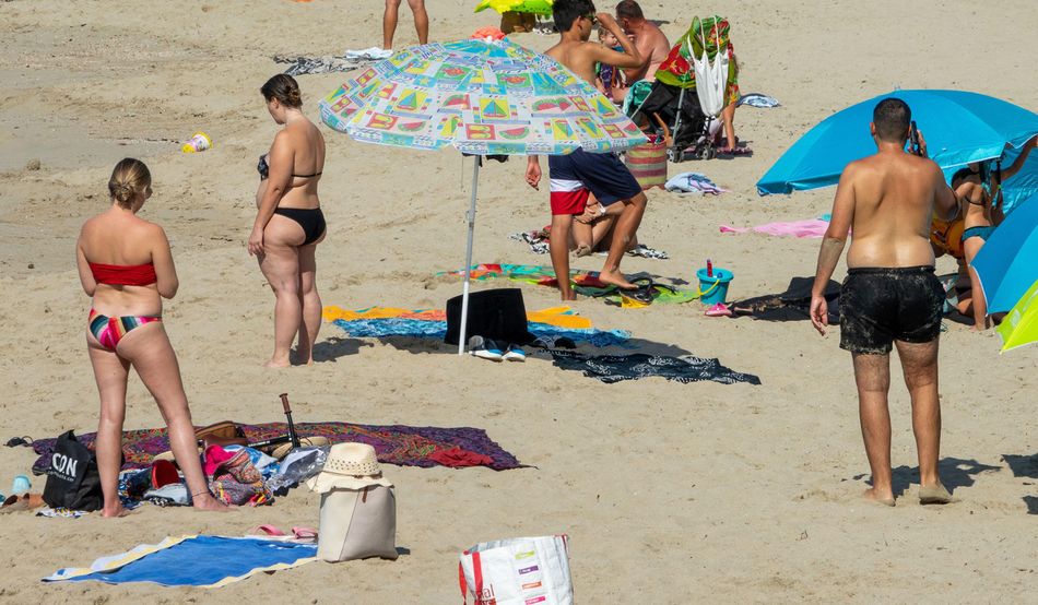 Tourists on the beach in Ibiza. Image: Alamy