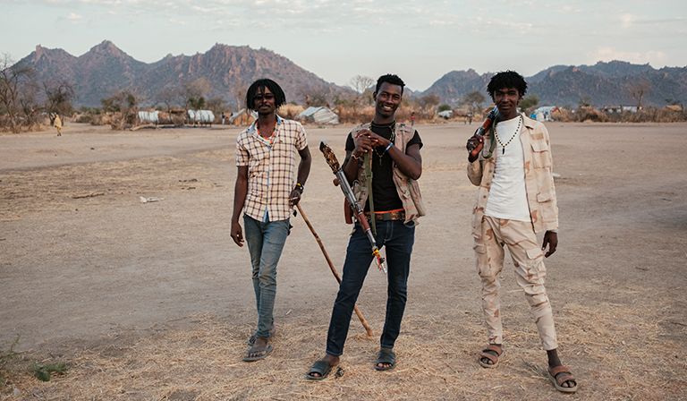 Three RSF members pose for portraits after a wedding in Dalami county © Guy Peterson
