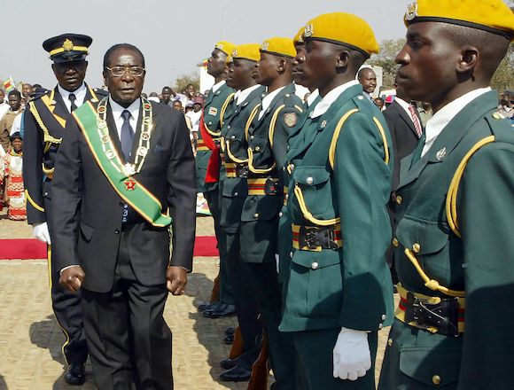 Zimbabwe's President Robert Mugabe inspects an honour guard upon his arrival to attend Heroes' Day commemorations in Harare 13 August 2007. Zimbabwe celebrated the day to commemorate heroes and heroines who died during the country's liberation struggle fr