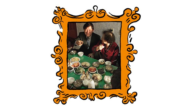 A family shares a meal to mark the lunar new year. Image: Alex Zuccarelli / Alamy