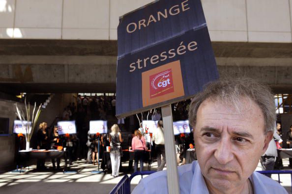 Employees of Orange mobile company, a division of French telecoms giant France Telecom, demonstrate against their job conditions on September 15, 2010 in Marseille, southeastern France, during a meeting of France Telecom CEO Stephane Richard with company executives. Europe's biggest Internet provider and its third mobile operator, trading internationally as Orange, France Telecom has undergone major restructuring to confront growing competition. Placard reads : "Orange : Stress". AFP PHOTO ANNE-CHRISTINE POUJOULAT (Photo credit should read ANNE-CHRISTINE POUJOULAT/AFP/Getty Images)