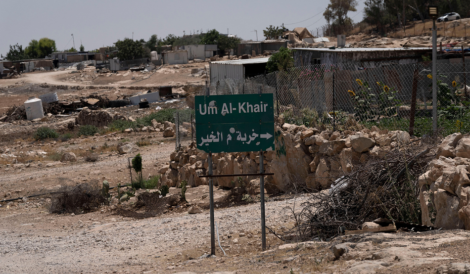 Caravans and simple structures for residents of the West Bank Bedouin village of Umm al-Khair in July 2024. Image: AP / Alamy