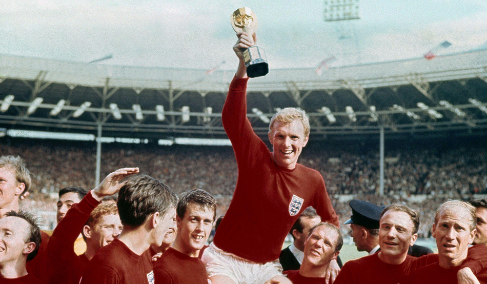 England captain Bobby Moore holds aloft the World Cup in 1966. Photo by Associated Press / Alamy