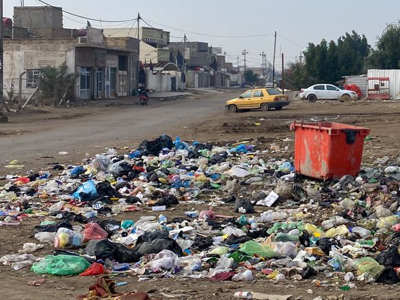 Rubbish strewn by the road side in Al Hilal, one of the poorest areas of the poorest provinces in the whole of Iraq