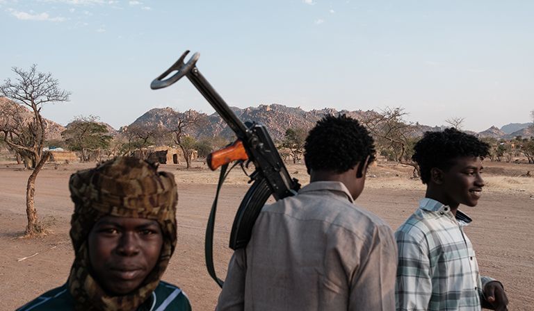 Teenage boys in a camp in Tongoli, Delami county, Sudan.
One wears a headscarf synonymous with RSF paramilitaries © Guy Peterson