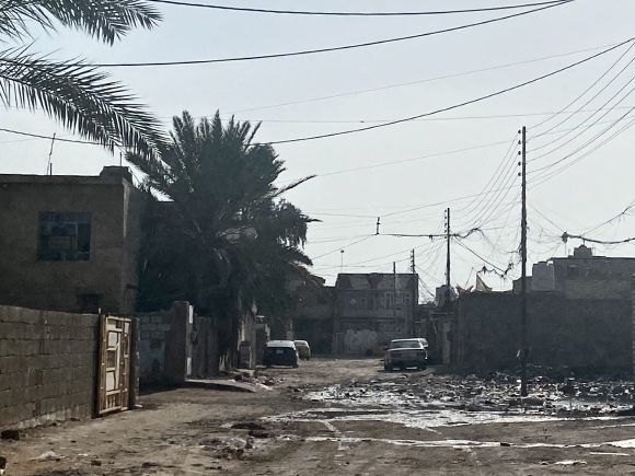 A street in a poor area south of Baghdad. Poor areas in Iraq often don't have paved streets or drainage, despite the country's oil wealth