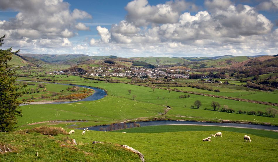 A view of Machynlleth from the west, showing the river Dovey and surrounding areas. Credit: Tony Boydon/Alamy