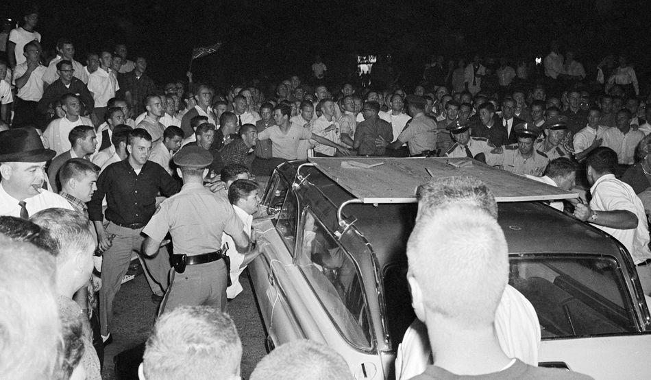 A photograph from 1962, of white students rioting over the enrolment of James Meredith, a black student, at the University of Mississippi. Photo © Shutterstock