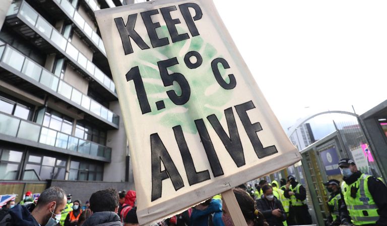 In 2021, protestors at COP26 in Glasgow called for world leaders to uphold their promise to limit  the rise in global temperatures. The goal—1.5°C—may be slipping out of reach © Associated Press / Alamy Stock Photo