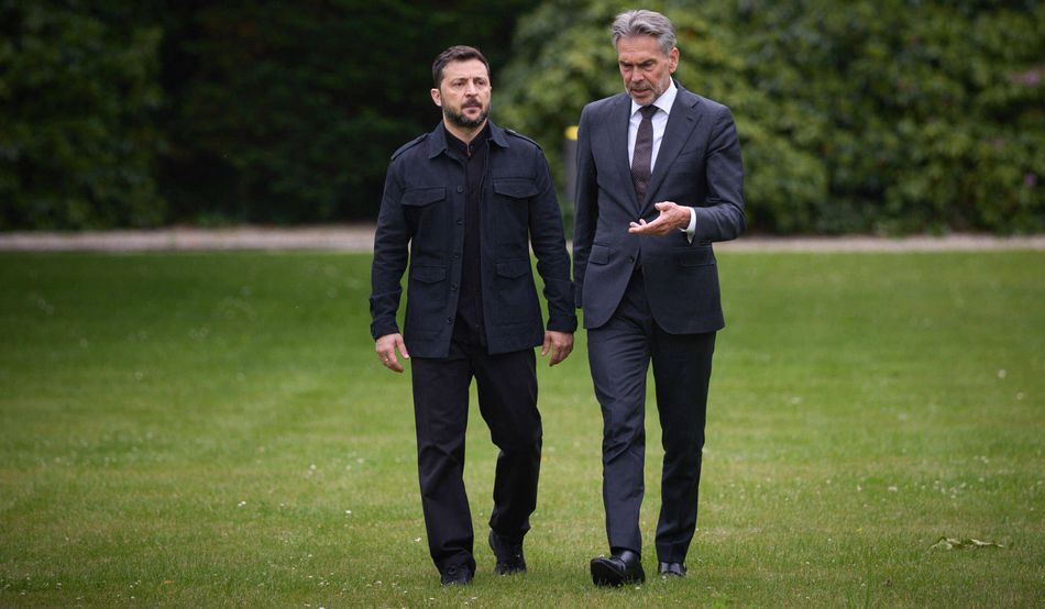 Suit or no suit? Zelensky steps out at a Nato summit (with former Dutch PM Dick Schoof) in a much disputed outfit. Image: Alamy Stock Photo