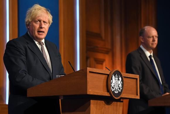2G6D6X1 Prime Minister Boris Johnson (left) and Chief Medical Officer Professor Chris Whitty during a media briefing in Downing Street, London, on coronavirus (Covid-19). Picture date: Monday July 5, 2021.