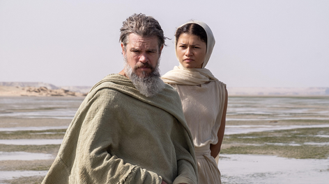 Zendaya, as Athena, accompanies Matt Damon’s Odysseus. Credit: Syncopy Production / Universal Pictures / Album / Alamy