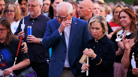 Minnesota governor Tim Walz and his wife Gwen attend a candlelight vigil on 18th June for former House Speaker Melissa Hortman and her husband Mark, who were fatally shot. Image by Associated Press / Alamy Stock Photo