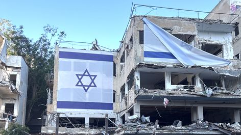 The site where an Iranian ballistic missile hit in Tel Aviv, Israel. Image: Alona Ferber